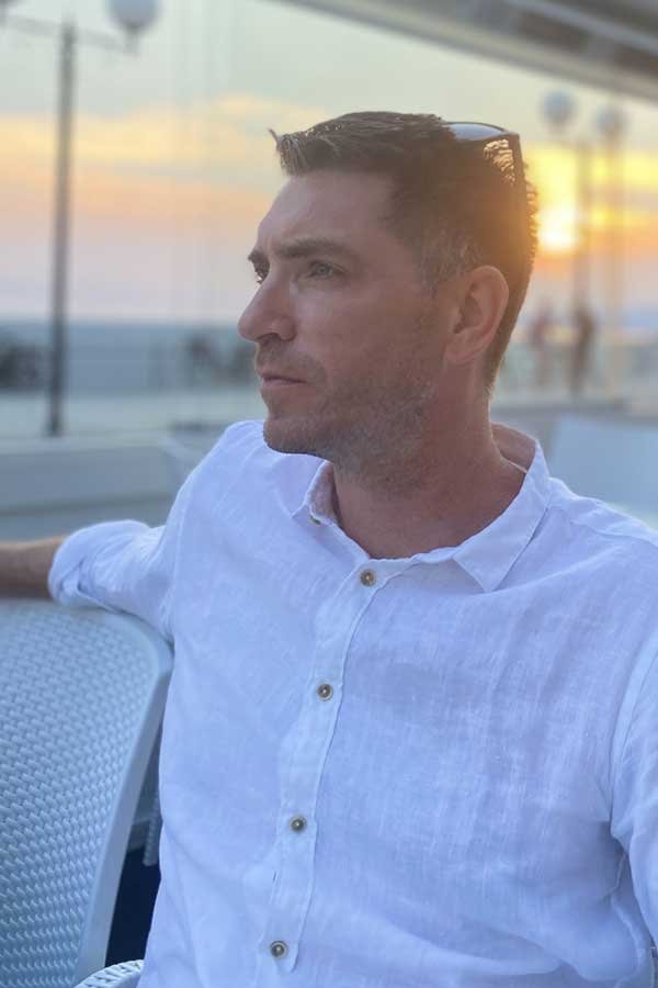 Ben Crum, photographed outdoors at sunset.